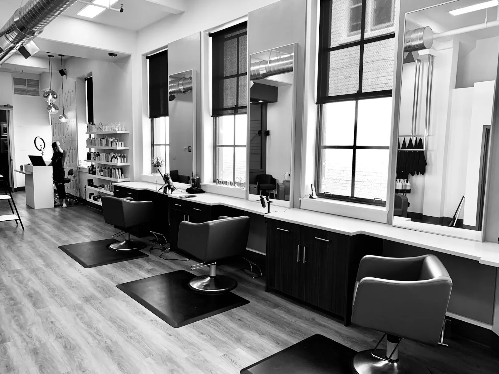 Lumière salon interior with stylists working